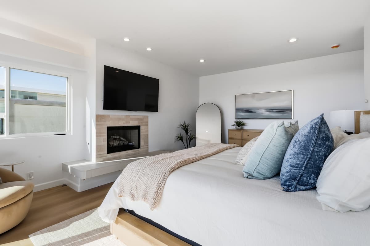 Primary suite seating beside its private fireplace