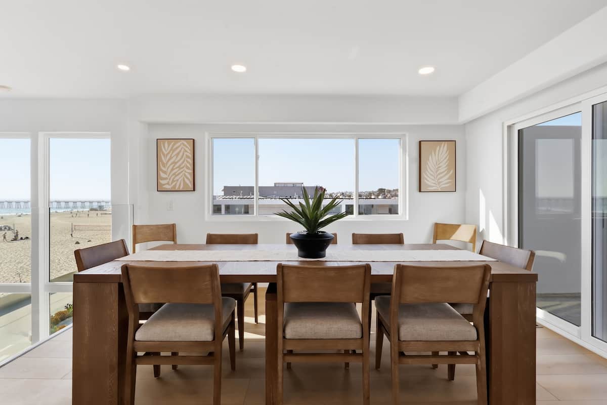 Dining room beside floor-to-ceiling ocean views